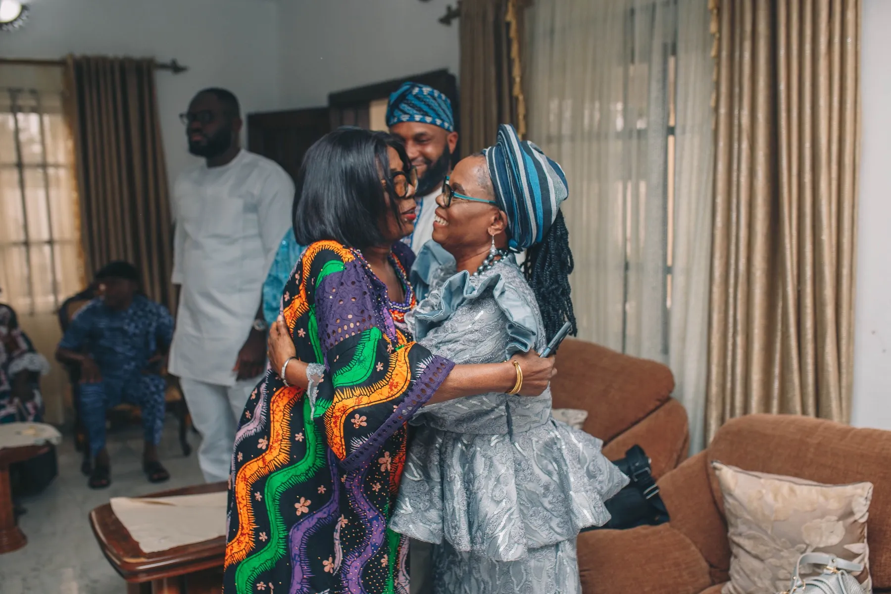 families embracing in the living room