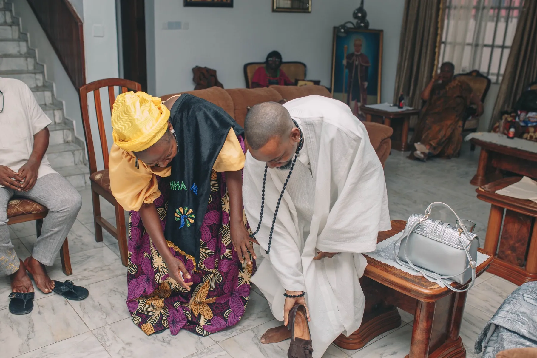adeilé kneeling to receive blessings