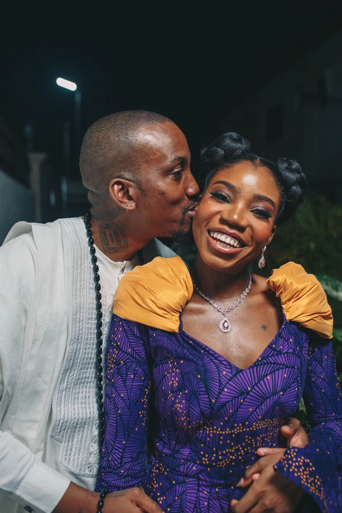 adeilé beaming as ekanem kisses her cheek