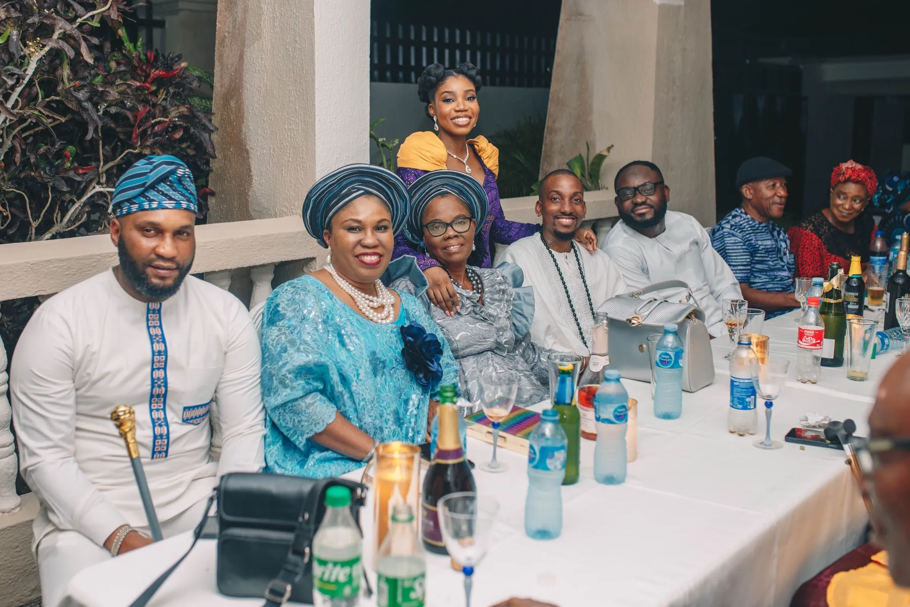 family seated around the long dinner table